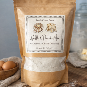 Brush Creek Farm organic waffle and pancake mix in rustic brown paper bag.