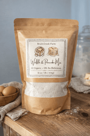 Brush Creek Farm organic waffle and pancake mix in rustic brown paper bag.